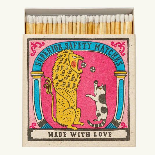 Matches with a colorful design featuring a lion and a cat on a pink background.