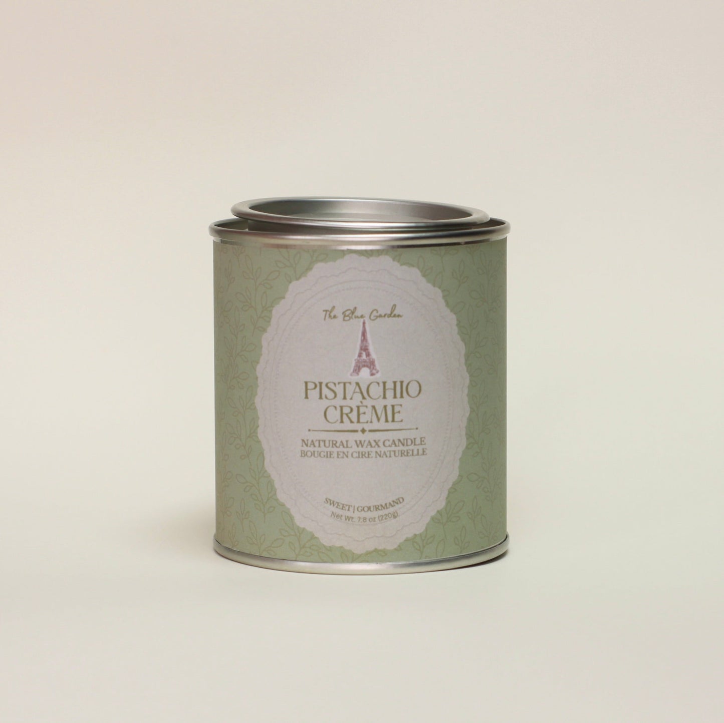 Can of pistachio creme on a light beige background