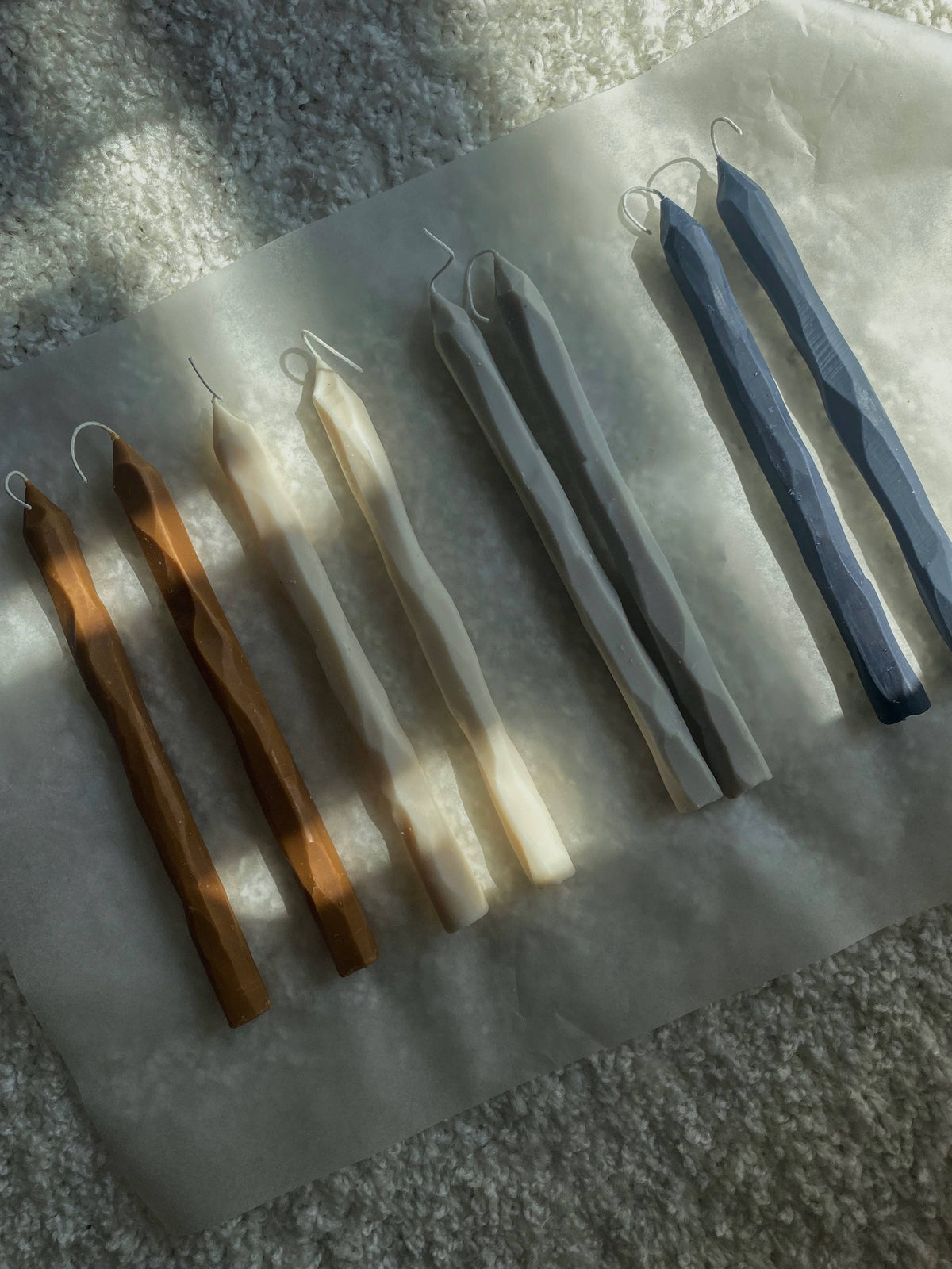 Set of metal tools on a white cloth with a textured background